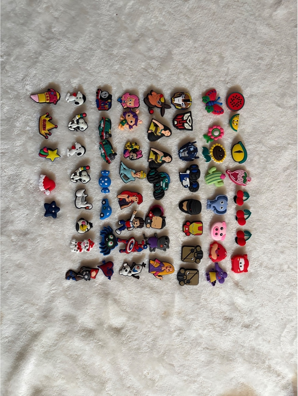 Jubbitz collection of colorful cartoon-themed shoe charms